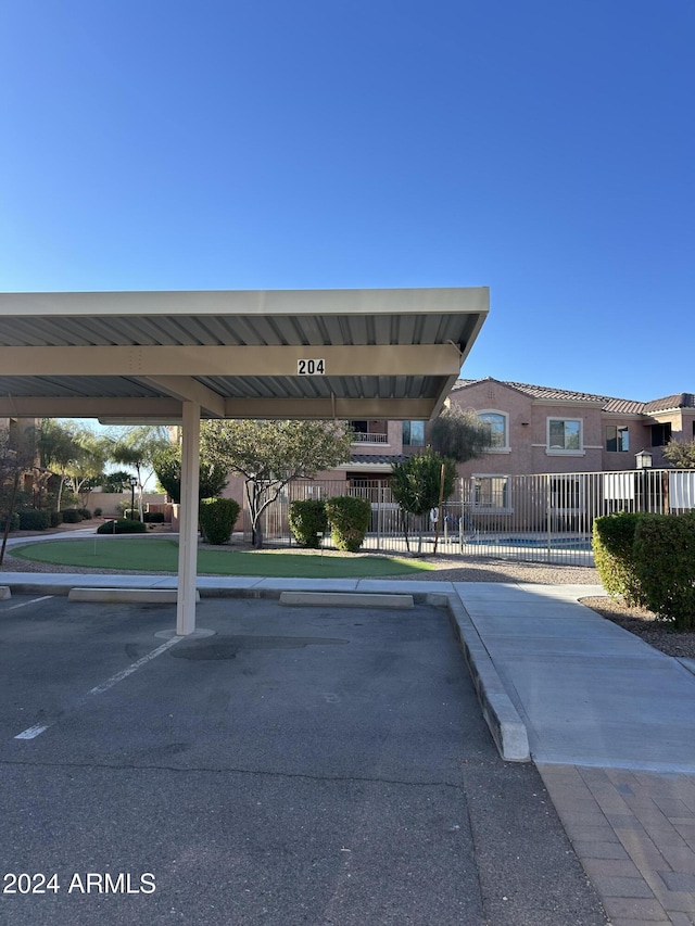 view of vehicle parking featuring a carport