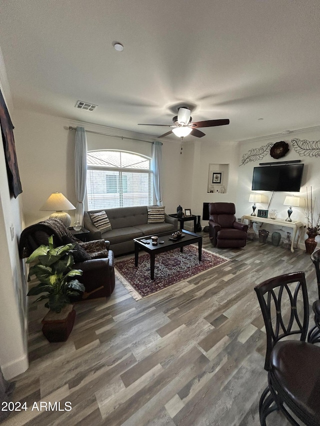 living room featuring ceiling fan and wood-type flooring