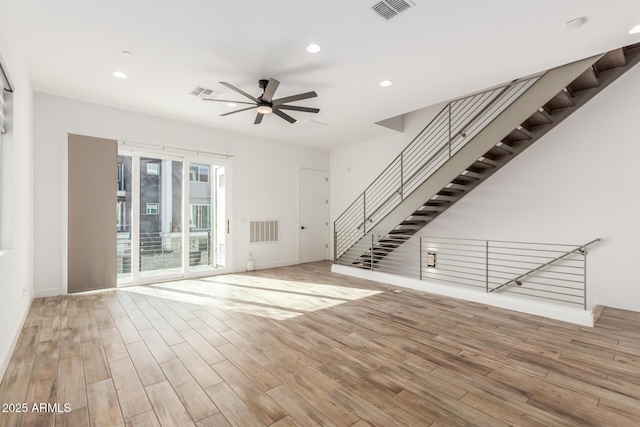 unfurnished living room featuring ceiling fan