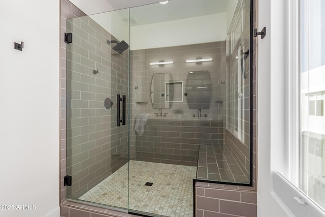 bathroom featuring a shower with shower door