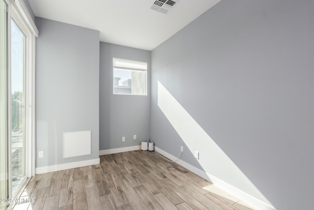 empty room with light hardwood / wood-style floors