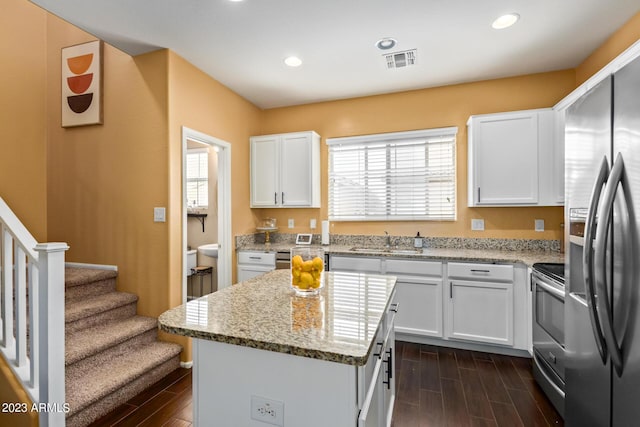 2031 N 77th Ln, Phoenix, AZ 85035 - kitchen featuring appliances with stainless steel finishes, a sink, dark wood-style floors, healthy amount of natural light, and recessed lighting