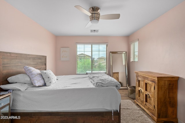 2031 N 77th Ln, Phoenix, AZ 85035 - bedroom featuring wood finished floors and ceiling fan