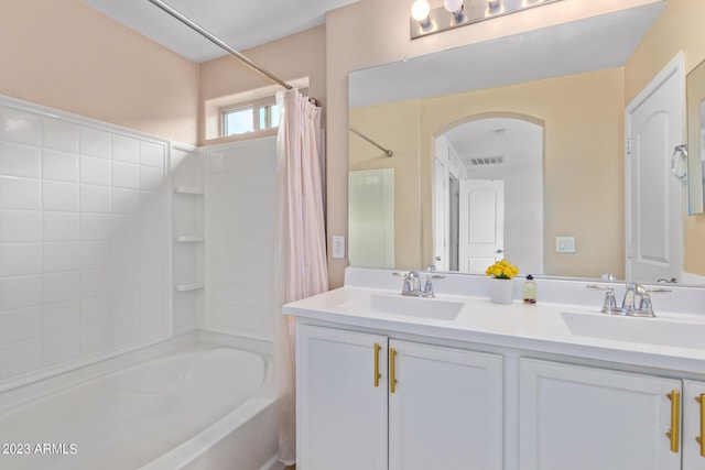 2031 N 77th Ln, Phoenix, AZ 85035 - full bath featuring shower / bath combination with curtain and double vanity