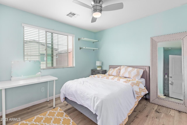 2031 N 77th Ln, Phoenix, AZ 85035 - bedroom featuring wood finished floors, baseboards, and a ceiling fan