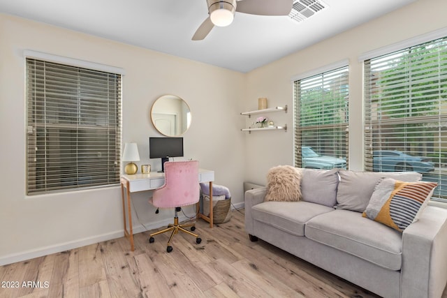 2031 N 77th Ln, Phoenix, AZ 85035 - office featuring wood finished floors, ceiling fan, and baseboards