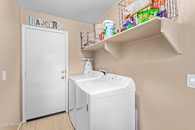 2031 N 77th Ln, Phoenix, AZ 85035 - washroom featuring washing machine and dryer and light tile patterned floors