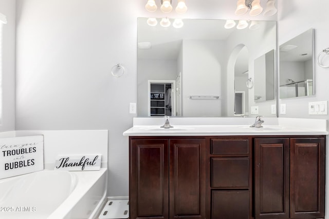 bathroom with vanity and a bathing tub