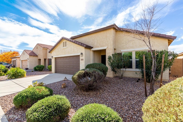 mediterranean / spanish-style home with a garage