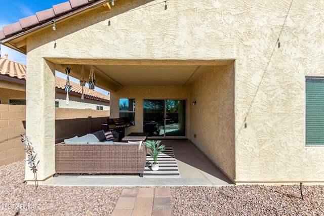 view of patio / terrace featuring an outdoor living space and a grill