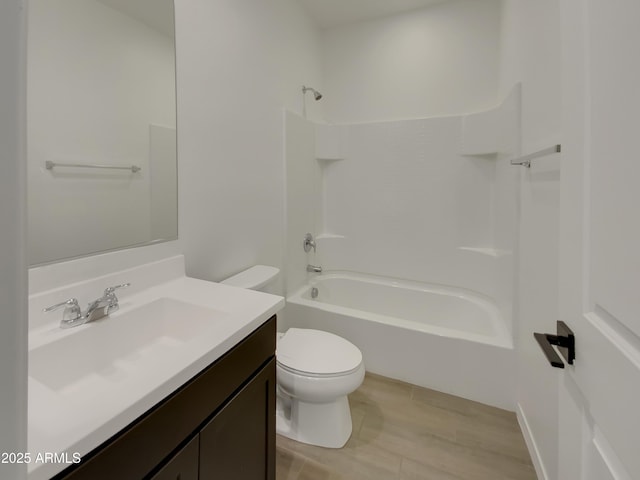 bathroom featuring vanity, toilet, and shower / bathtub combination