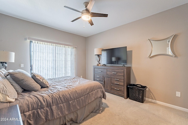 bedroom featuring ceiling fan and light colored carpet