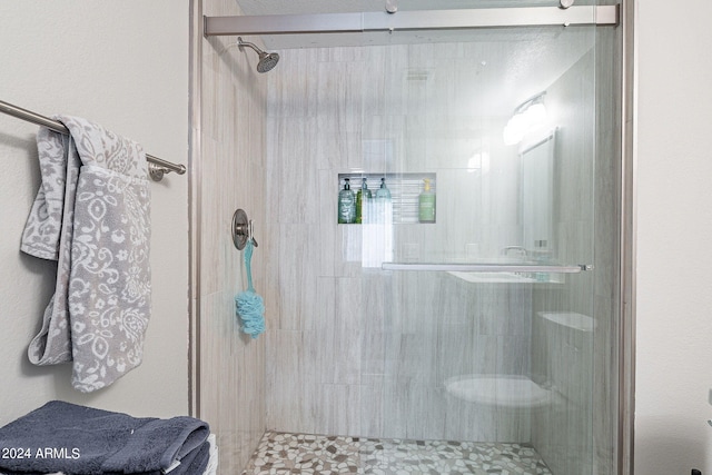 bathroom featuring an enclosed shower