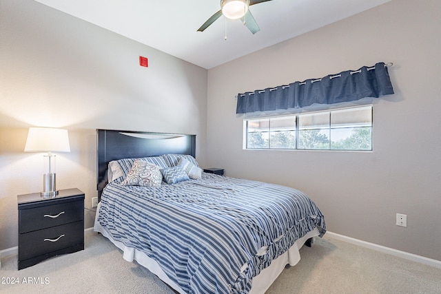 bedroom featuring ceiling fan and light colored carpet