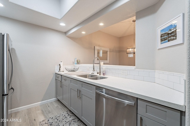 interior space featuring wood-type flooring, vanity, and decorative backsplash