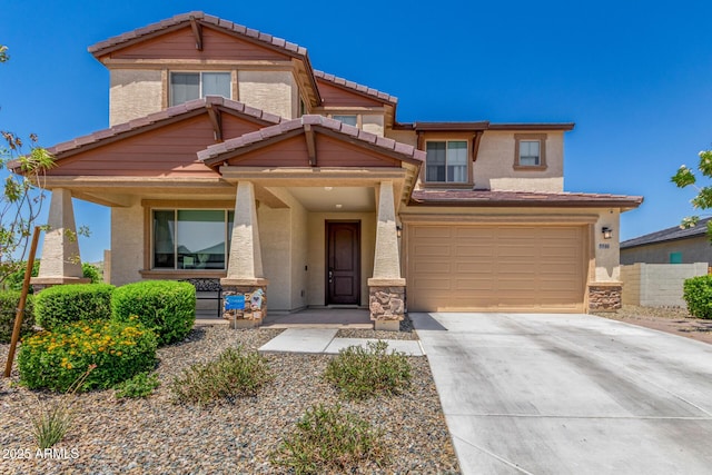 5516 N 193rd Ave, Litchfield Park, AZ 85340 - view of front of home featuring a tile roof, concrete driveway, a garage, covered porch, and stucco siding