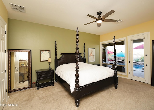 bedroom featuring light carpet, access to outside, and visible vents