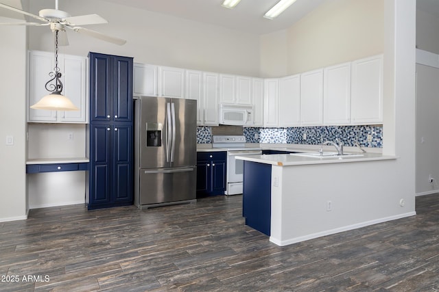 2641 E Brooks St, Gilbert, AZ 85296 - kitchen featuring decorative backsplash, white appliances, light countertops, a sink, and blue cabinetry
