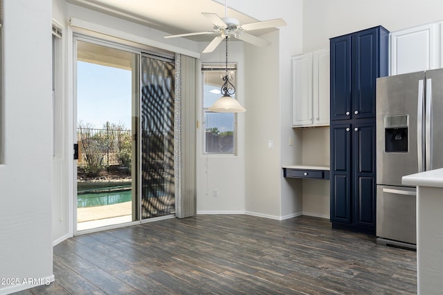 2641 E Brooks St, Gilbert, AZ 85296 - unfurnished dining area with a ceiling fan, baseboards, and dark wood-style floors