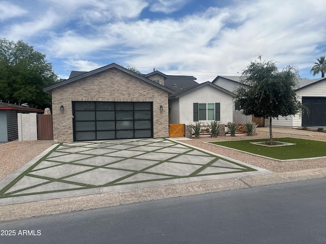 4132 N 42nd St, Phoenix, AZ 85018 - view of front facade featuring driveway and an attached garage
