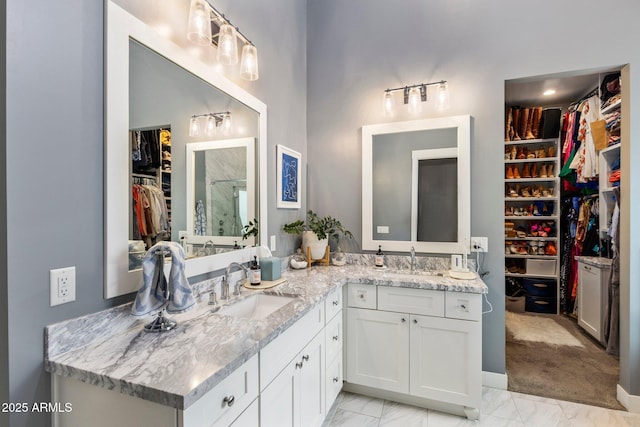 4132 N 42nd St, Phoenix, AZ 85018 - bathroom with vanity, a spacious closet, marble finish flooring, and walk in shower