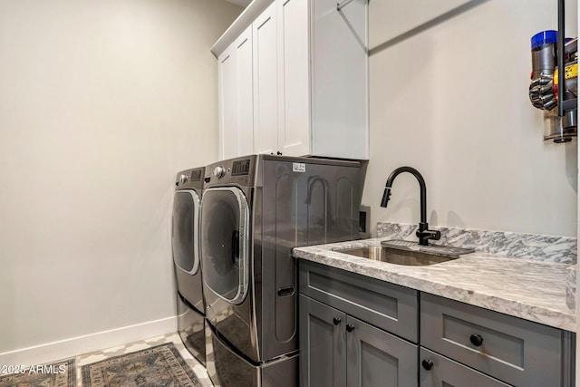 4132 N 42nd St, Phoenix, AZ 85018 - laundry area with cabinet space, washing machine and dryer, and baseboards