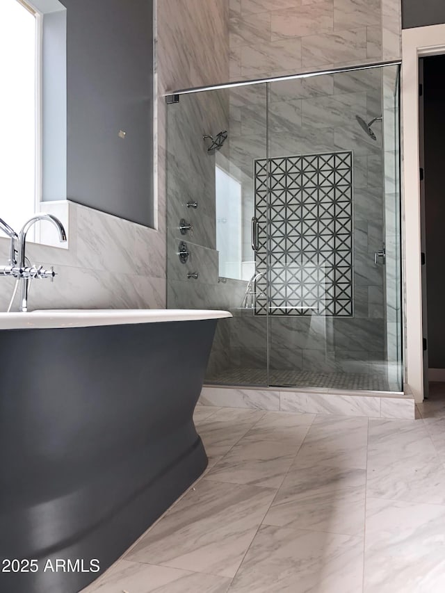 4132 N 42nd St, Phoenix, AZ 85018 - full bath with a shower stall, a soaking tub, and tile walls