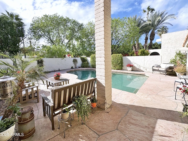 view of pool with a fenced in pool, a patio, and a fenced backyard