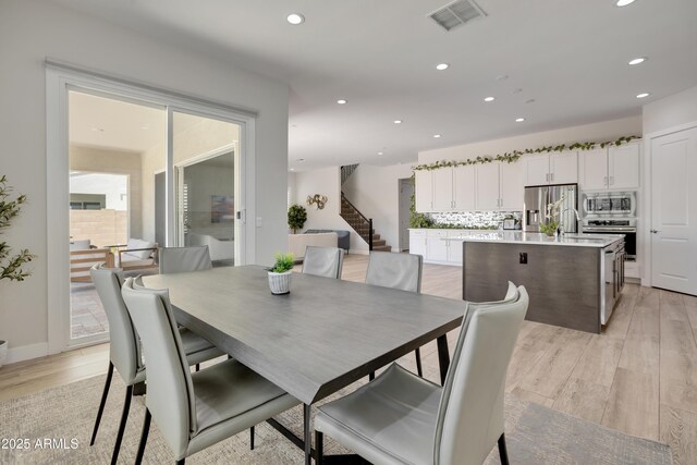 24314 N 21st Pl, Phoenix, AZ 85024 - dining area with recessed lighting, stairs, and light wood-style floors