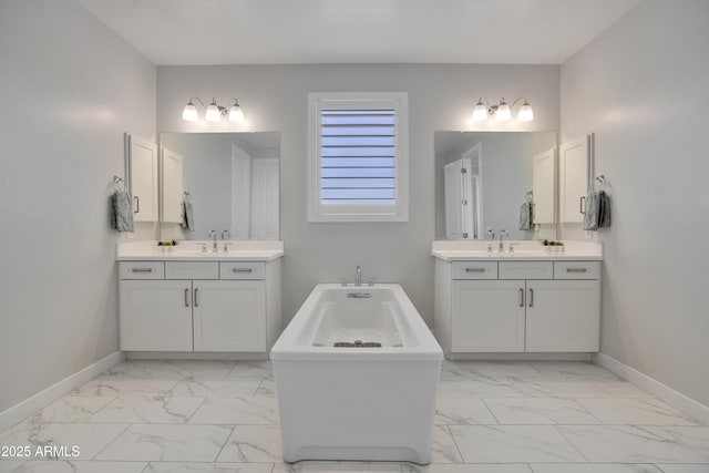24314 N 21st Pl, Phoenix, AZ 85024 - full bath featuring marble finish floors, baseboards, a freestanding bath, and two vanities