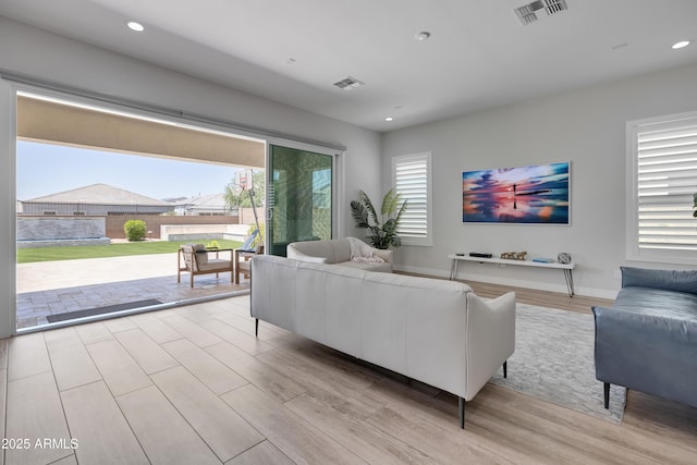 24314 N 21st Pl, Phoenix, AZ 85024 - living room featuring wood finished floors and recessed lighting