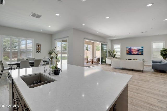 24314 N 21st Pl, Phoenix, AZ 85024 - kitchen featuring a sink, recessed lighting, healthy amount of natural light, and light wood-style floors
