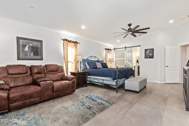 bedroom featuring baseboards, a barn door, and recessed lighting