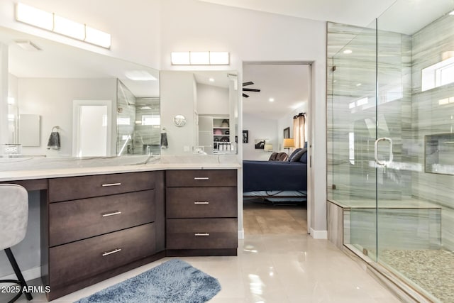 full bathroom with a stall shower, ensuite bath, a ceiling fan, and vanity