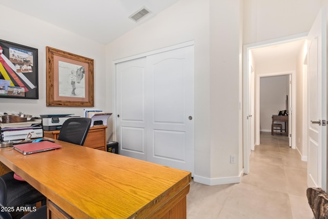 office space with visible vents and baseboards