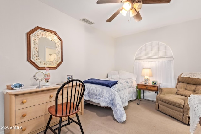 bedroom with light carpet, ceiling fan, and visible vents