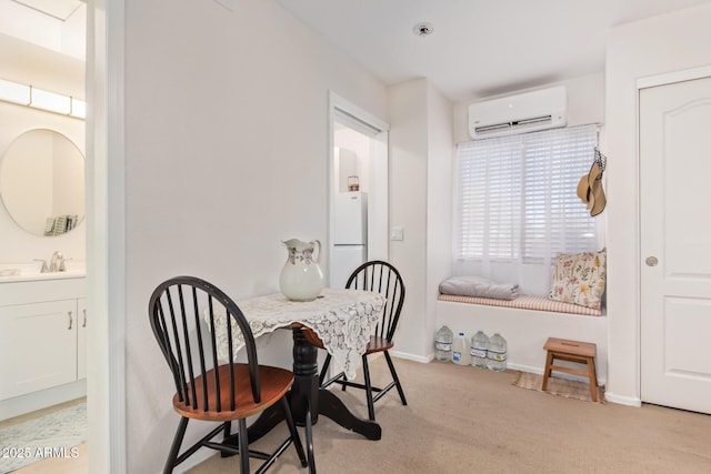 dining room with light colored carpet, baseboards, and a wall mounted AC