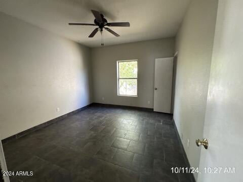 empty room featuring ceiling fan