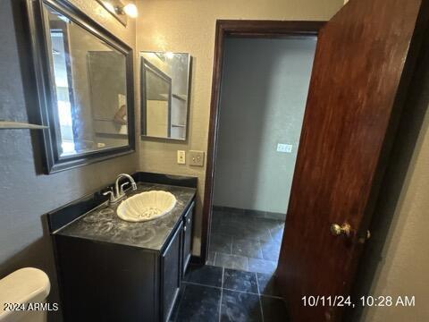 bathroom with vanity and toilet