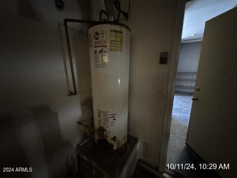 utility room with water heater