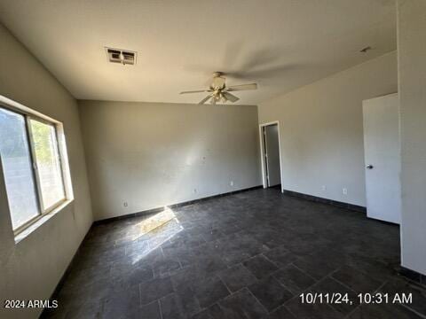 unfurnished room with ceiling fan