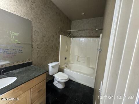 full bathroom featuring bathing tub / shower combination, vanity, and toilet