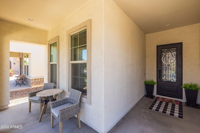 entrance to property featuring a patio area