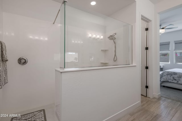 bathroom with a shower, tile flooring, and ceiling fan