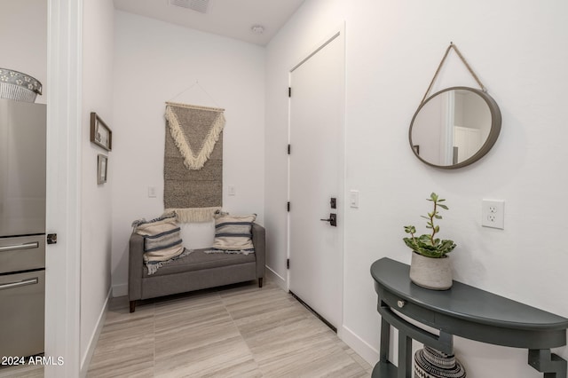 sitting room featuring light tile floors