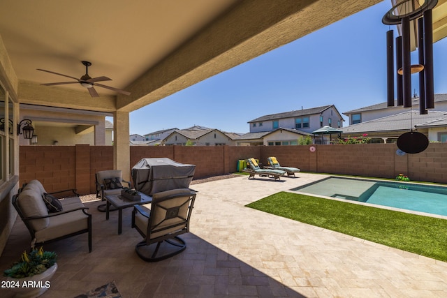 view of terrace with an outdoor living space and ceiling fan