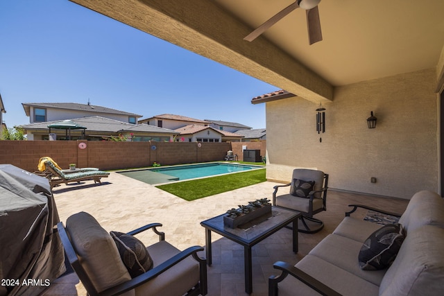 view of patio / terrace featuring ceiling fan and a fenced in pool