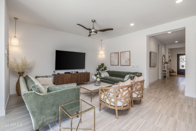 living room featuring ceiling fan