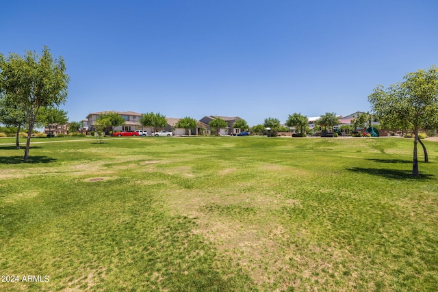 view of property's community with a lawn