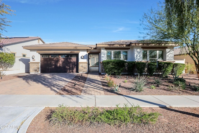 view of front of property with a garage